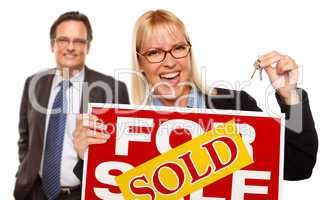 Man with Blonde Woman Holding Keys and Sold For Sale Sign