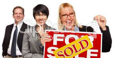 Real Estate Team with Woman Holding Keys and Sold For Sale Sign