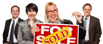 Real Estate Team with Woman Holding Keys and Sold For Sale Sign