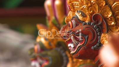 Demon guardian carving on temple pillar, Bali.