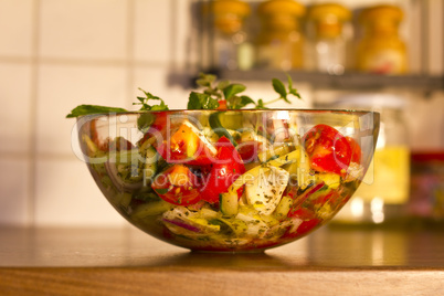 Salad in glass dish in the kitchen