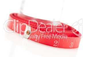 Red Measuring Tape and Water Bottle on White