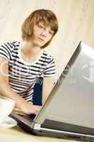 Young woman sitting in front of laptop