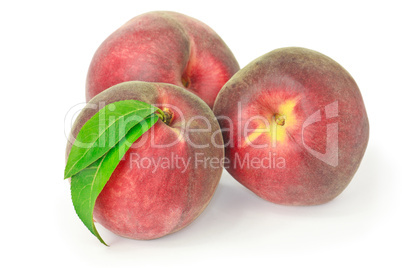 Three peaches isolated on white