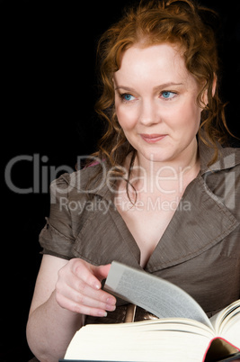 Reading girl distracted from her work