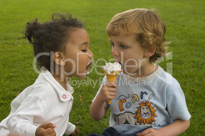 Two Children Sharing An Ice Cream Cone