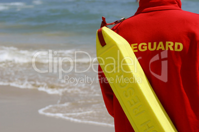 Lifeguard With Rescue Float At A Beach