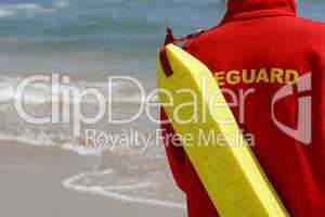Lifeguard With Rescue Float At A Beach