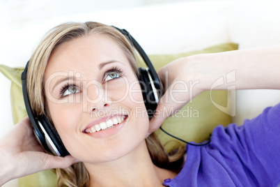 Joyful woman  listening to music in the living-room