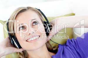 Joyful woman  listening to music in the living-room