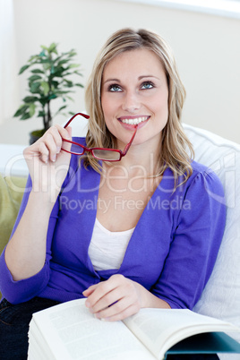 Handsome woman holding glasses