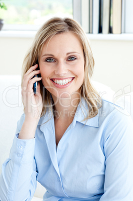 Handsome confident businesswoman using a mobile phone