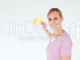 Smiling woman painting a room
