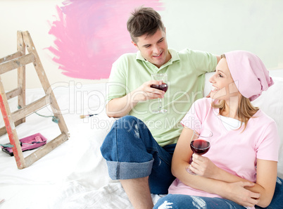 Cheerful couple drinking a glass wine