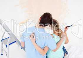 Young couple looking at a painted wall