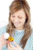 Ill young woman holding  pills