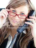 Attractive business woman on phone  wearing red glasses