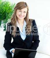 Beautiful businesswoman using a laptop