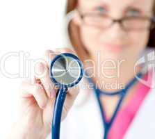 Close-up of a female doctor showing a stethoscope