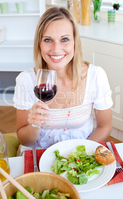Smiling woman with a glass of wine
