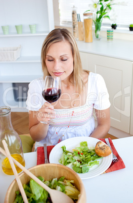 Handsome woman drinking wine