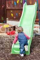 Little girl having fun with a chute