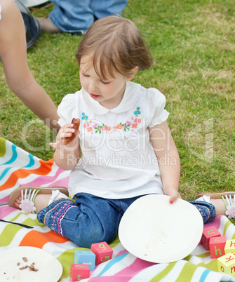 Portrait of a little girl having a picnic
