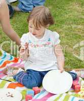 Portrait of a little girl having a picnic