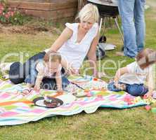 Mother and daughters having a picnic together
