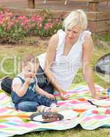 Cute Mother and daughter having a picnic together