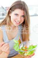 Handsome woman eating a salat