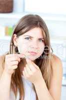 Young woman standing in front of a mirror