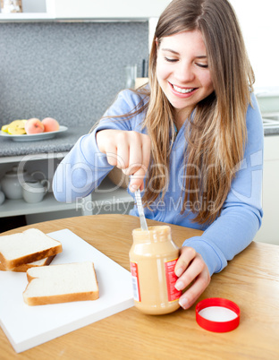 Glowing woman woman eating peanut butter