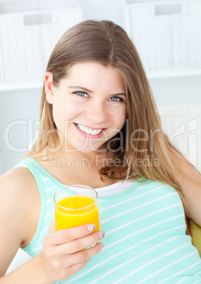 Charming woman drinking orange juice