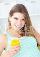 Charming woman drinking orange juice