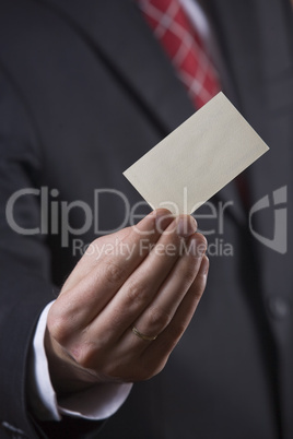 Businessman holding card