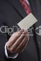 Businessman holding card