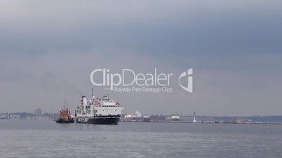 Cargo-and-passenger ship arriving at sea port