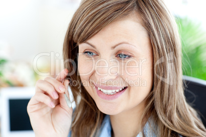 Smilling woman sitting on a chair