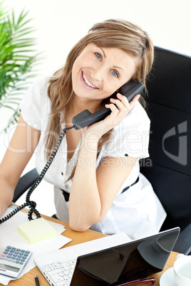 Gladsome woman sitting on a chair and phoneing