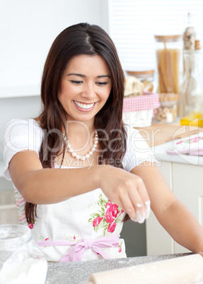 Bright female woman is cooking in kitchen