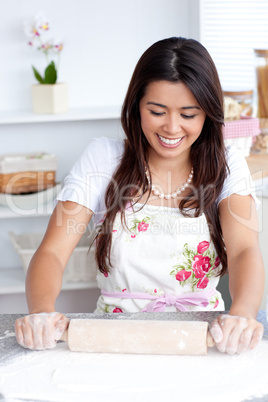 Cute female woman is cooking in kitchen