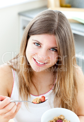 Attractive woman having breakfast in the kitchen