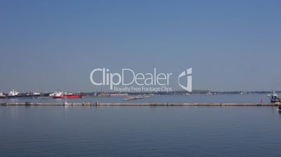 Tug-boat at the sea trading port (Full HD)
