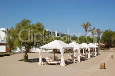 Huts at the beach of luxury hotel, Crete, Greece