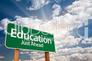 Education Green Road Sign Over Clouds