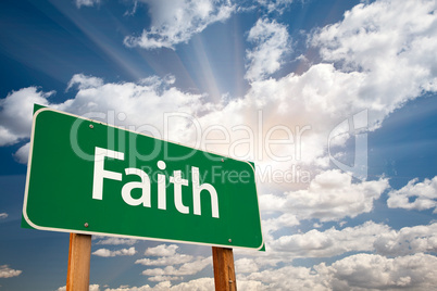 Faith Green Road Sign Over Clouds