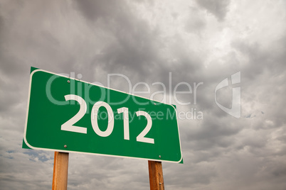 2012 Green Road Sign Over Storm Clouds