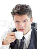 Attractive businessman drinking coffee