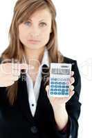 Depressed businesswoman holidng a calculator